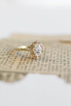 a close up of a ring on top of a newspaper