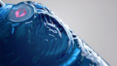 a close up of a blue bottle with water on it