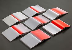 six pieces of paper with red and white strips on them, arranged in the shape of rectangles