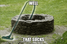 a vacuum cleaner is cleaning a stone well that says well that sucks on the bottom