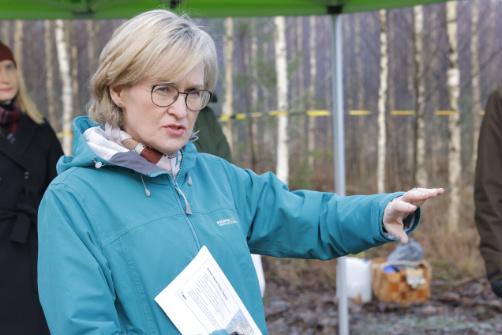 Mairead McGuinness wearing outdoor gear in a forest.